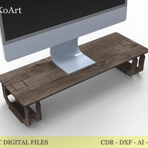 Könnte beinhalten: Ein Monitorständer aus Holz mit dunkler brauner Holzmaserung. Der Ständer ist rechteckig mit einem geschwungenen Design an den Seiten. Der Text "LASER CUT DIGITAL FILES" ist unten sichtbar.