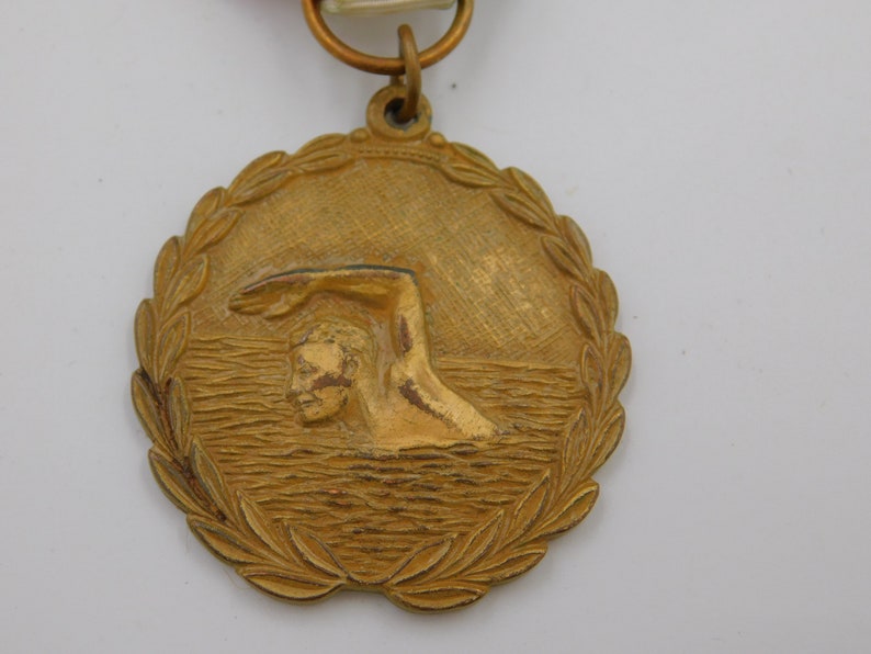 Vintage NCA YMCA Dist Meet Gold Swimming Medal Pin Ribbon dr69