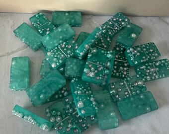 Pearl embedded set of dominoes.  Teal in color set of 28