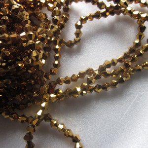 Gold Bicone Glass Beads 4mm 14 Inch Strand