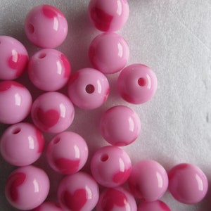 Roze acrylkralen rond hart 12 mm 14 kralen