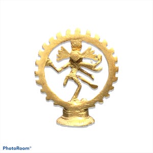 May include: A gold-colored statue of a dancing deity, framed by a circular, gear-like design. The figure has multiple arms and is posed dynamically. The statue is set on a pedestal, and the overall design is intricate and detailed.