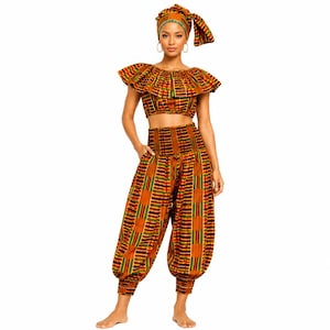 May include: A patterned two-piece outfit comprising a crop top, high-waisted trousers, and a head wrap. The ensemble features a vibrant mix of orange, yellow, green, and black stripes. The crop top has a ruffled neckline, and the trousers have a gathered waist and ankle cuffs.