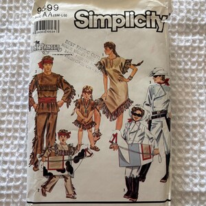 May include: A Simplicity sewing pattern envelope, number 9699, size AA (SM-LG). The front features illustrations of individuals wearing costumes inspired by The Lone Ranger, including fringed outfits and a hobby horse accessory, with text.