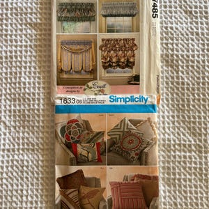 May include: A McCall's Home Decorating pattern featuring window treatments and decorative pillows. The pattern includes images of various curtain styles and pillow designs. The Simplicity pattern also includes the price of $16.95.