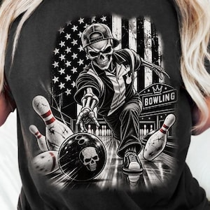 May include: A black t-shirt featuring a graphic of a skeleton wearing a cap and bowling shirt, throwing a bowling ball with a skull design. The background includes a distressed American flag and bowling pins, with the word BOWLING in a box.