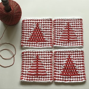 May include: Four square, red and white crocheted coasters with a Christmas tree design. A spool of red and gold twine sits next to the coasters, suggesting a holiday theme. The coasters are approximately 4 inches square.