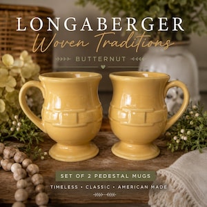 May include: A set of two yellow ceramic pedestal mugs with a raised woven basket-weave texture around the center. The mugs feature a smooth, glossy finish, a flared rim, and a sturdy handle. The text Longaberger Woven Traditions Butternut is visible.