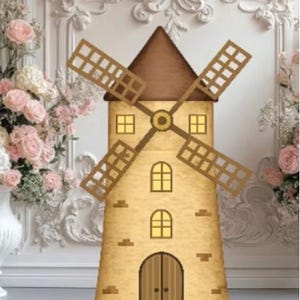 May include: A decorative windmill cutout featuring a tan stone-textured base, a brown conical roof, and four brown lattice blades. The structure includes a central arched door and four small yellow-lit windows. The text 6x4 is printed at the base.