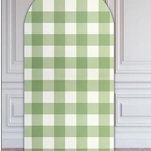 May include: A large, arched backdrop featuring a green and white gingham pattern. The backdrop is 71 inches high and 36 inches wide. The text "AB4949" is at the top, and "H71"xW36"" is at the bottom. The backdrop is set against a white wall.