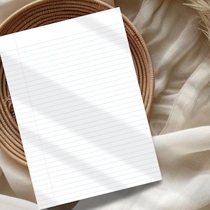 May include: A single sheet of white paper with horizontal blue lines and a vertical red margin line on the left side. The paper is rectangular and features a clean, blank surface ready for writing, positioned at an angle against a textured background.