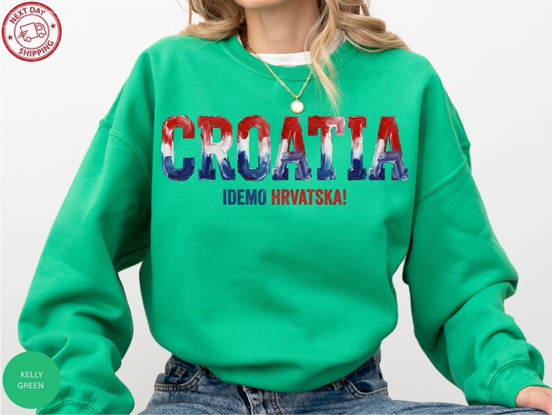 A person wearing a green sweatshirt with the word "Croatia" printed on it.