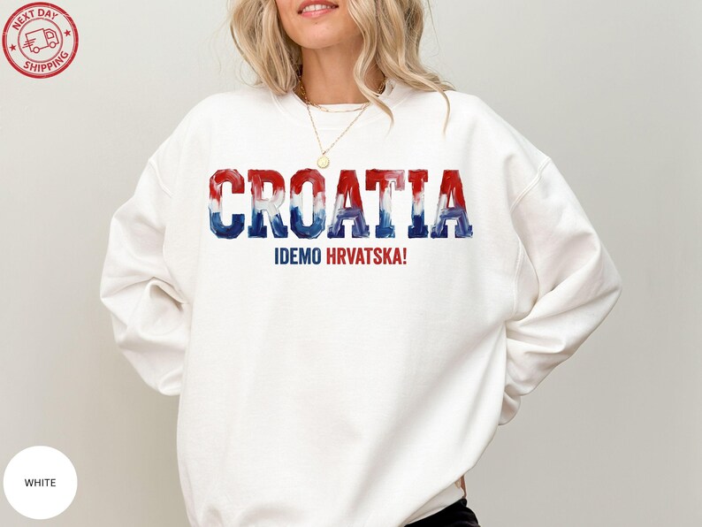 A woman wearing a white sweatshirt with the text "Croatia" printed on it.