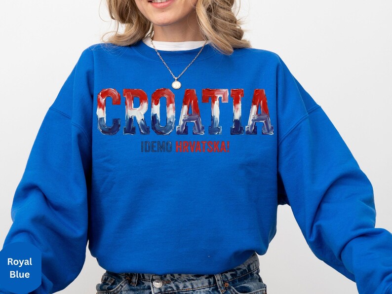 A woman wearing a blue sweatshirt with the word "Croatia" printed on it.