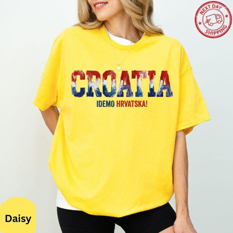 A woman wearing a yellow t-shirt with the word "Croatia" printed on it.