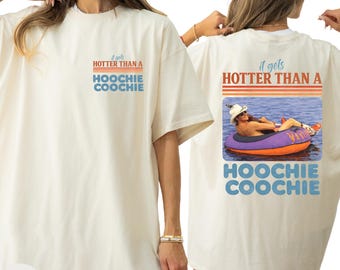 Camiseta "Más caliente que una hoochie coochie", camiseta para concierto 2026, camiseta con meme de colores veraniegos y cómodos.