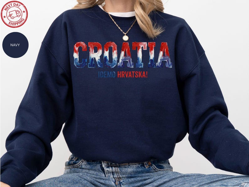 A navy blue sweatshirt with the word "Croatia" printed on it in a stylized font.