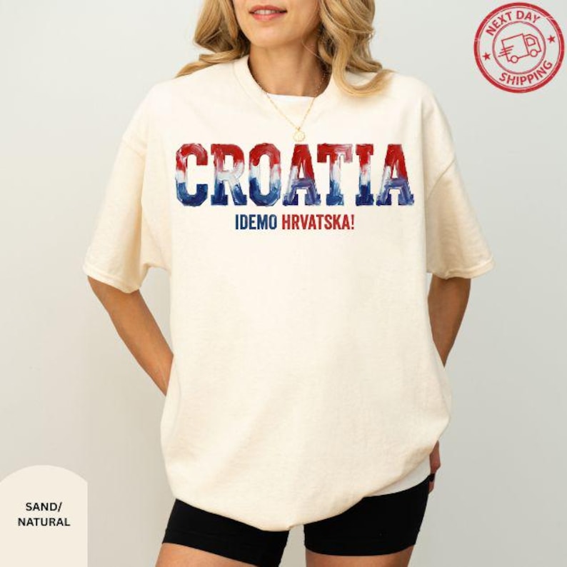 A woman wearing a white t-shirt with the word "Croatia" printed on it.