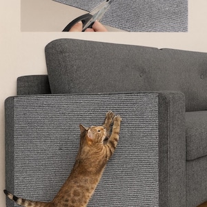 May include: A gray, textured cat scratching protector is being cut with scissors and applied to the arm of a gray sofa. A tabby cat is shown scratching the protector. The protector is designed to prevent cats from scratching furniture.