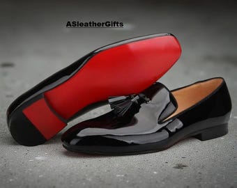 Christian Louboutin - Mocasines con borlas de diente de león - Piel de becerro acharolada - Zapatos negros
