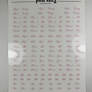 May include: A white sheet of water decals by POISE NAILZ featuring rows of repeating phrases in a dark red cursive script. The text includes Angel Energy, Born to Die, Eternal Love, Fallen Angel, Forgive Me, Forever Yours, Heaven Sent, Kiss Me, and Lost Soul.