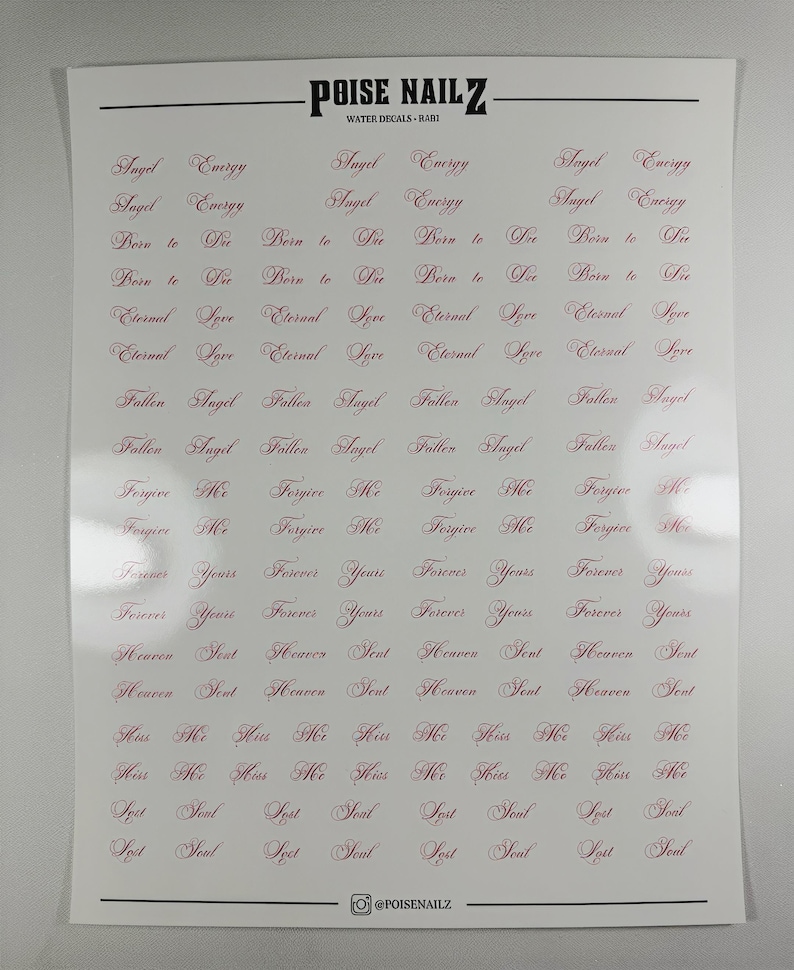 May include: A white sheet of water decals by POISE NAILZ featuring rows of repeating phrases in a dark red cursive script. The text includes Angel Energy, Born to Die, Eternal Love, Fallen Angel, Forgive Me, Forever Yours, Heaven Sent, Kiss Me, and Lost Soul.
