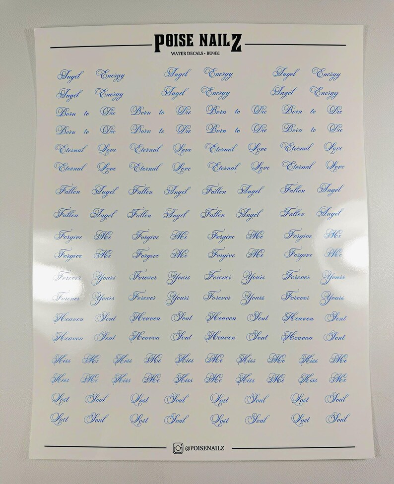 May include: A white sheet of water nail decals by POISE NAILZ featuring multiple rows of blue cursive text including phrases like Angel Energy, Born to Die, Eternal Love, Fallen Angel, Forgive Me, Forever Yours, Heaven Sent, Kiss Me, and Lost Soul.