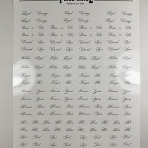 May include: A white sheet of water decals by POISE NAILZ featuring rows of black cursive text including phrases like Angel Energy, Born to Die, Eternal Love, Fallen Angel, Forgive Me, Forever Yours, Heaven Sent, Kiss Me, and Lost Soul.
