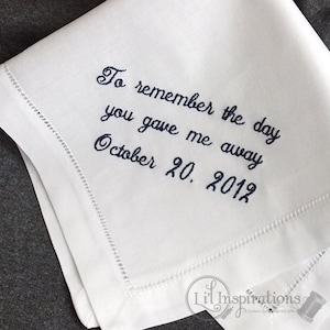 May include: White linen handkerchief with embroidered text: "To remember the day you gave me away October 20, 2012".