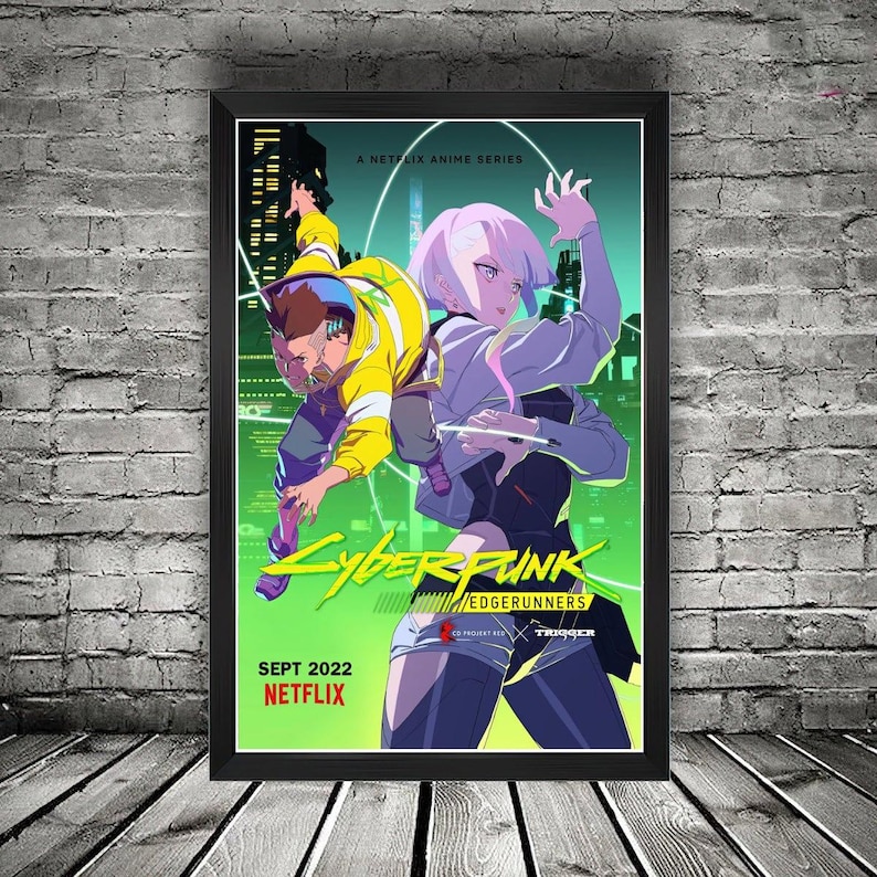 K&ouml;nnte beinhalten: Ein gerahmtes Poster mit Anime-Charakteren aus der Netflix-Serie "Cyberpunk: Edgerunners". Das Kunstwerk zeigt zwei Figuren in dynamischen Posen vor einem leuchtend gr&uuml;nen und gelben Hintergrund. Das Poster enth&auml;lt den Serientitel und das Netflix-Logo.