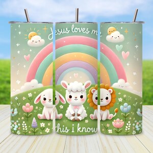 May include: A tumbler with a whimsical design featuring a rainbow, clouds, and adorable animal characters. The text "Jesus loves me, this I know" is displayed. The design is set against a green background with flowers.