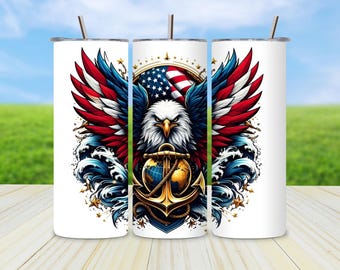 May include: White tumbler featuring a patriotic design with a bald eagle, American flag, and anchor. The eagle's wings are red, white, and blue. The design includes ocean waves and stars. The tumbler has a silver straw.