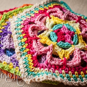 May include: A stack of colorful crocheted squares with a floral pattern in shades of pink, yellow, green, blue, and orange.