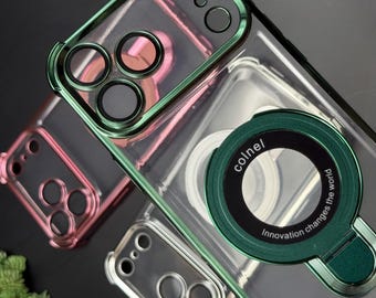 May include: Clear phone cases with colored trim in green and pink. The cases have a clear back and colored frames around the camera and edges. One case has a green ring with the text "colnel" and "Innovation changes the world."
