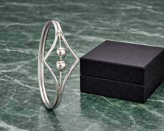 Bracciale rigido geometrico minimalista in argento, bracciale rigido con doppia sfera in filo metallico