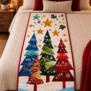 May include: A rectangular quilted table runner featuring a festive holiday design with colourful fabric Christmas trees in blue, green, red, and gold. The runner is decorated with embroidered snowflakes and stars on a cream background with a red border.