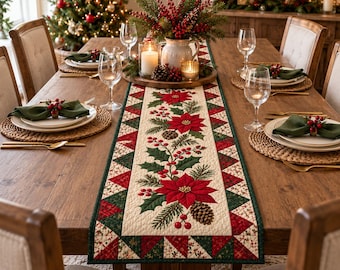 May include: A rectangular quilted table runner featuring a central cream-colored panel with a printed pattern of red poinsettia flowers, green holly leaves, pine branches, and brown pinecones, bordered by a geometric red and green triangle design.