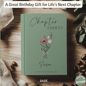 May include: A sage green hardcover book featuring the text Chapter THIRTY, the name Susan, and the phrase A NEW CHAPTER BEGINS. A floral illustration of a bouquet tied with a ribbon is centered on the cover. The text A Great Birthday Gift for Life's Next Chapter is displayed above the book.