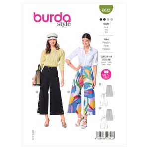 May include: Burda Style sewing pattern 6032 for pants in sizes US 8-18. The envelope displays two variations: solid black cropped pants with side button details and wide-leg pants featuring a colorful abstract floral print pattern.