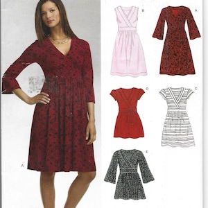 May include: A sewing pattern from New Look featuring a woman wearing a red dress with a floral pattern. The pattern includes illustrations of various dress designs, including a pink dress, a red wrap dress, and a striped dress.