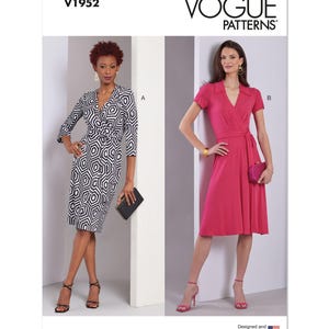May include: Vogue Patterns V1952. Two women's dresses are displayed. One is a black and white geometric print wrap dress. The other is a solid pink wrap dress. The Vogue Patterns logo is at the top of the image.