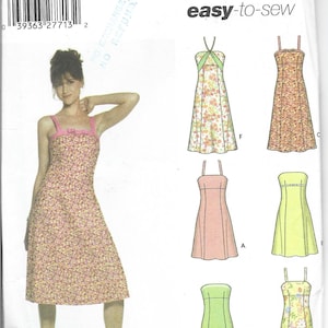 Könnte beinhalten: Simplicity Schnittmuster mit verschiedenen Kleiderdesigns. Das Muster enthält ein Kleid mit Blumendruck, das von einem Model getragen wird, sowie andere Kleiderstile. Das Muster ist mit "easy-to-sew" gekennzeichnet.