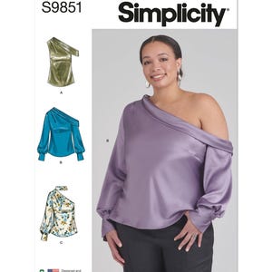 May include: Simplicity pattern S9851 features a one-shoulder top design. The image shows a woman wearing a lilac-coloured satin top. The pattern includes illustrations of the top in olive green, teal, and floral prints. The text "Simplicity" is displayed.