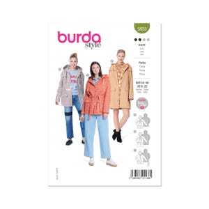 Peut inclure: Une couverture de magazine avec trois femmes présentant des parkas. Le logo Burda Style et le numéro 5923 sont visibles. Les parkas sont beiges, corail et gris. La gamme de tailles est EUR 34-48 et US 8-22.