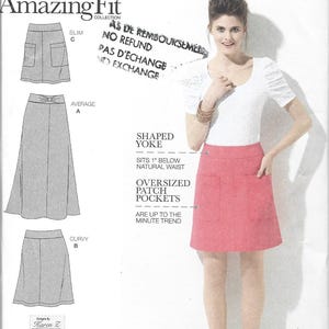 May include: Simplicity Amazing Fit sewing pattern 1717. The pattern shows a woman in a pink skirt with oversized patch pockets. The pattern includes options for slim, average, and curvy fits. The text on the pattern reads "Shaped Yoke" and "Are up to the minute trend."
