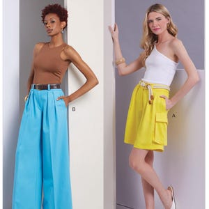 May include: Vogue Patterns V1958 sewing pattern envelope featuring two garment views. View B shows high-waisted, wide-leg bright blue trousers with a brown belt. View A shows bright yellow knee-length shorts with a rope belt and side cargo pockets.