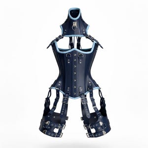 May include: A dark navy blue corset with light blue trim, featuring a high neck collar with a silver O-ring, vertical front busk closures, and integrated leg harness straps with multiple silver buckles and eyelets for adjustable fit.