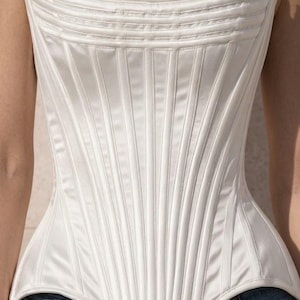 Handmade white satin overbust corset top with steel boning and a pointed hemline. Elegant medieval renaissance or festival outfit for women.