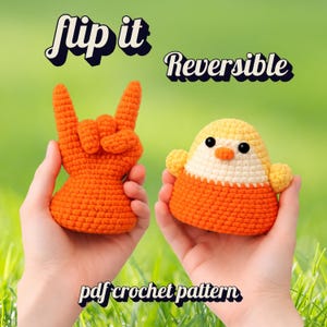May include: Two crocheted toys: an orange hand in a rock gesture and a chick in yellow, orange, and white. The image includes the text "flip it" and "Reversible". The bottom text says "pdf crochet pattern".