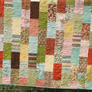 Easy precut quilt pattern designed for beginners using layer cakes and 10 inch fabric squares to create modern baby quilts and cozy throw quilts